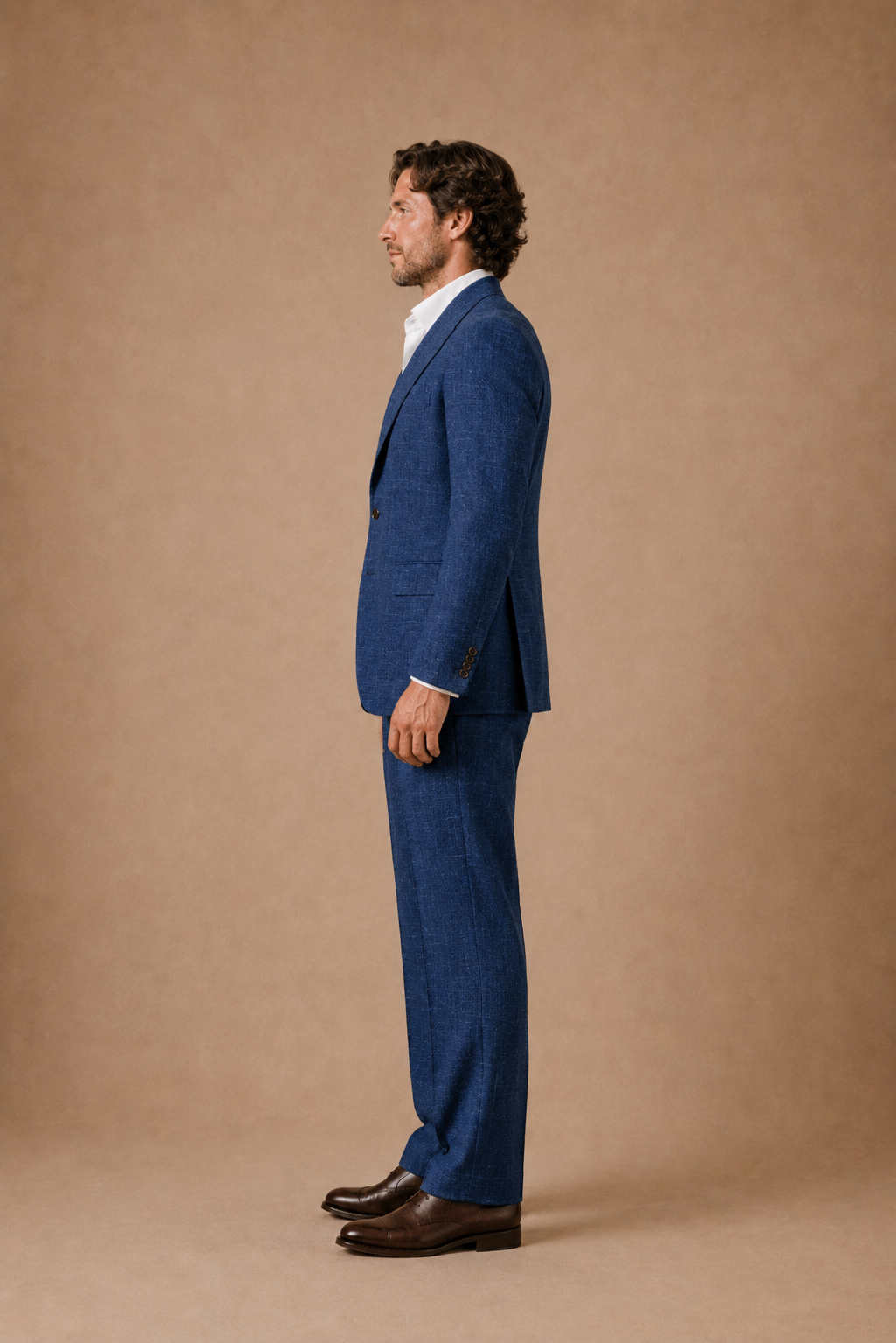 Riviera Blue modern fit men's suit jacket by Vellor Vault, angle view.