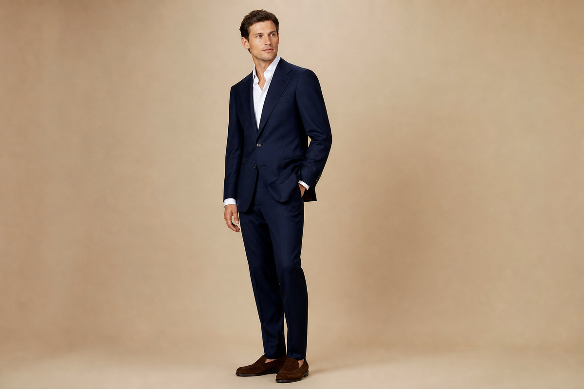 Navy modern-fit two-piece suit, editorial landscape hero.