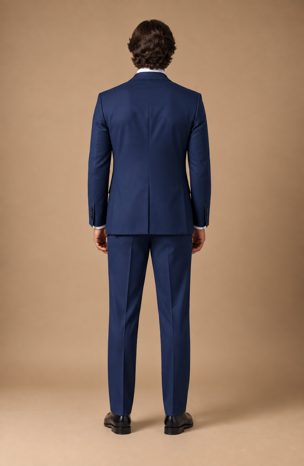 Navy modern fit men's suit jacket by Vellor Vault, back view.