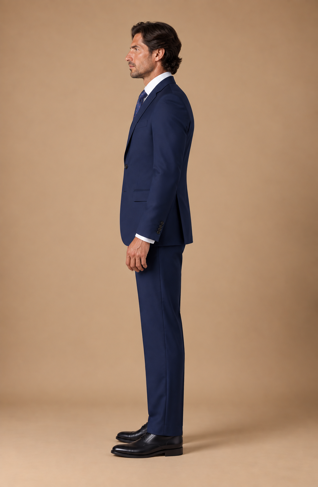 Navy modern fit men's suit jacket by Vellor Vault, side view.