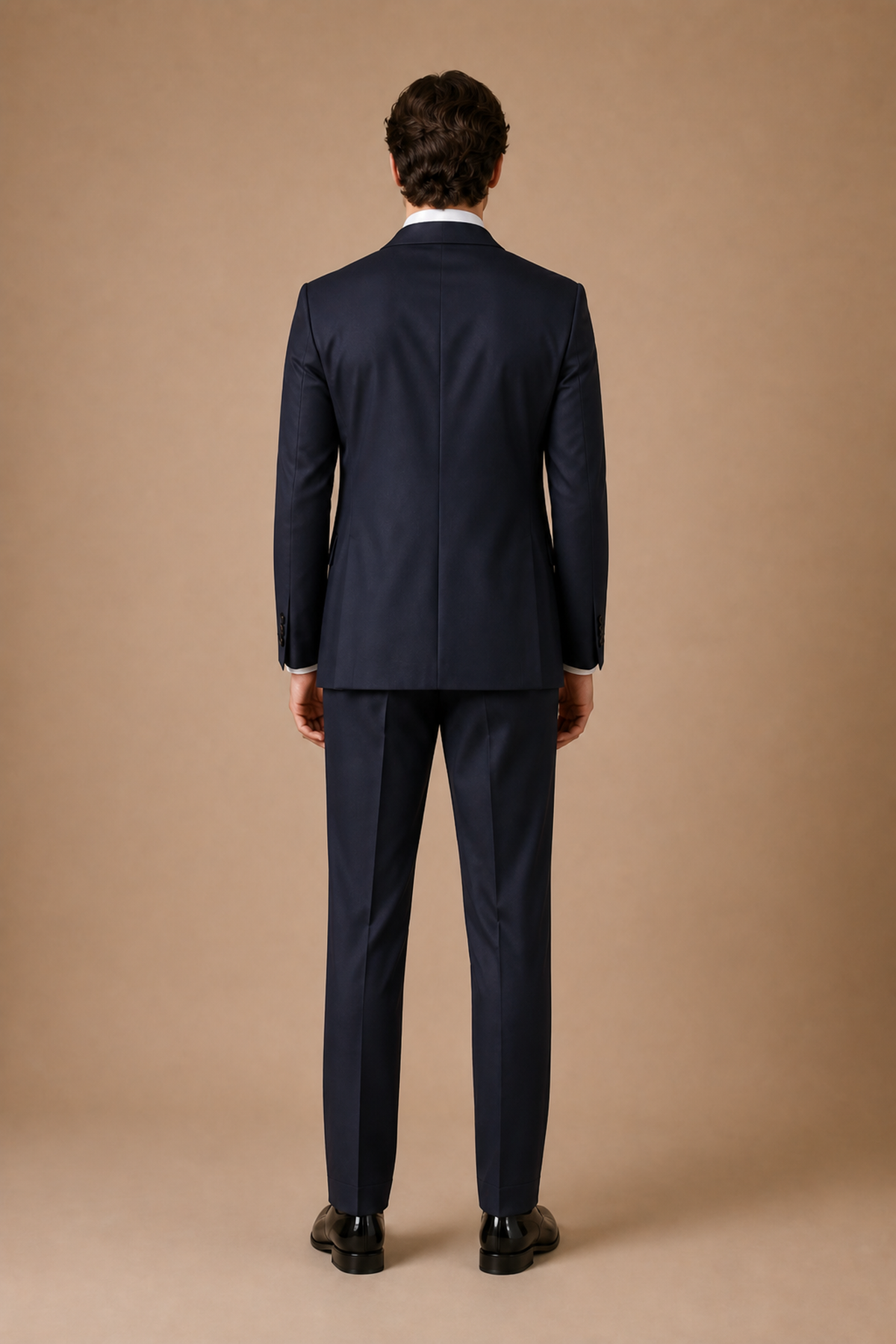 Navy modern fit men's tux jacket by Vellor Vault, back view.