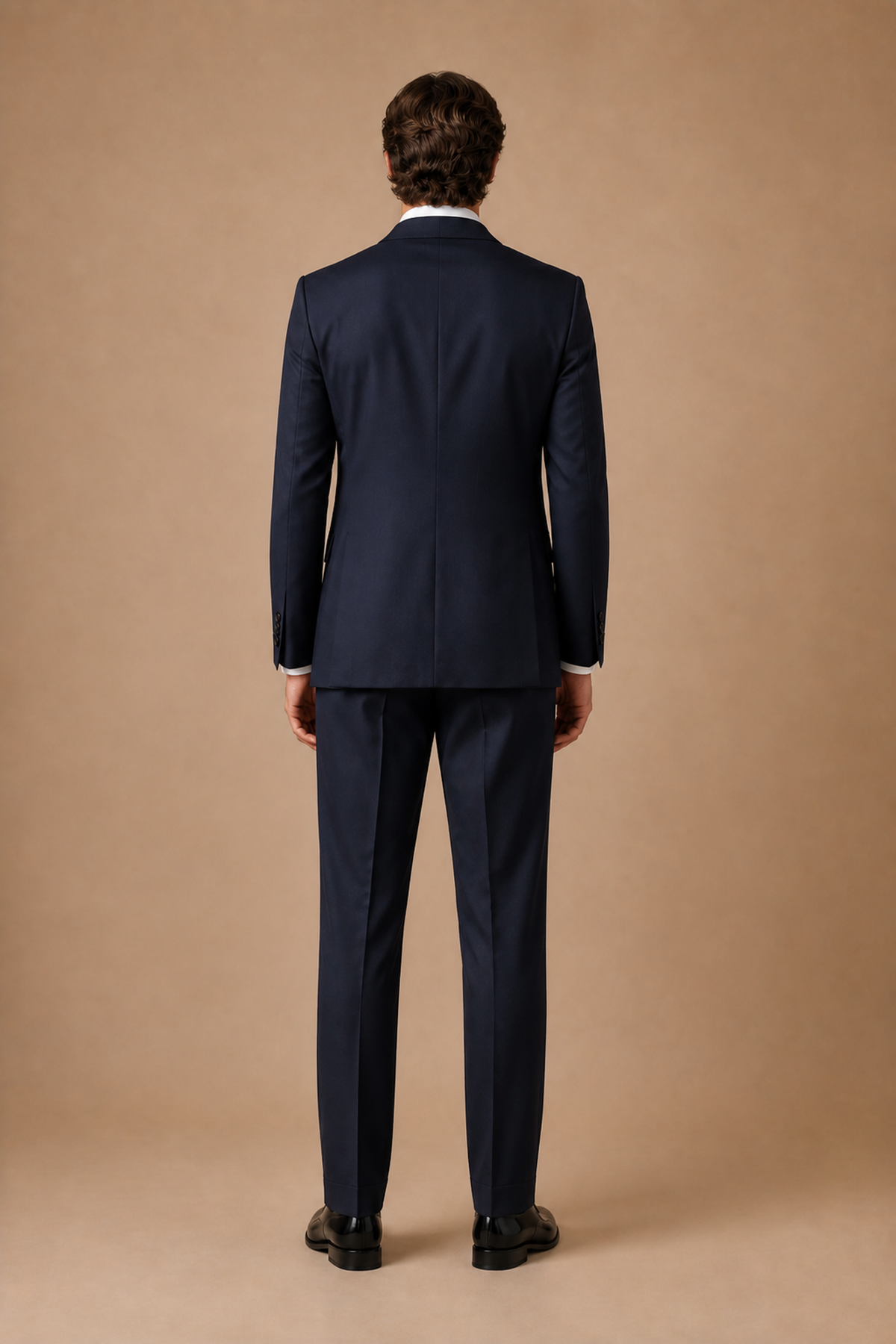 Navy modern fit men's tux jacket by Vellor Vault, back view.